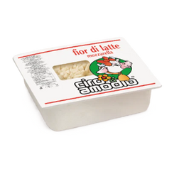 Block of mozzarella cheese in a white container with 