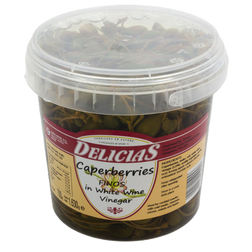 Jar of Delicias caperberries in white wine vinegar on a white background